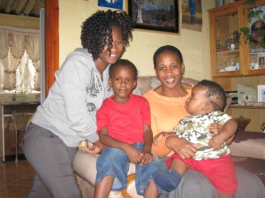 Zanele, her two daughters Nana and Aphile, and neighbor boy